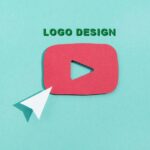 logo design concept: a white arrow and red YouTube logo cut from cardboard