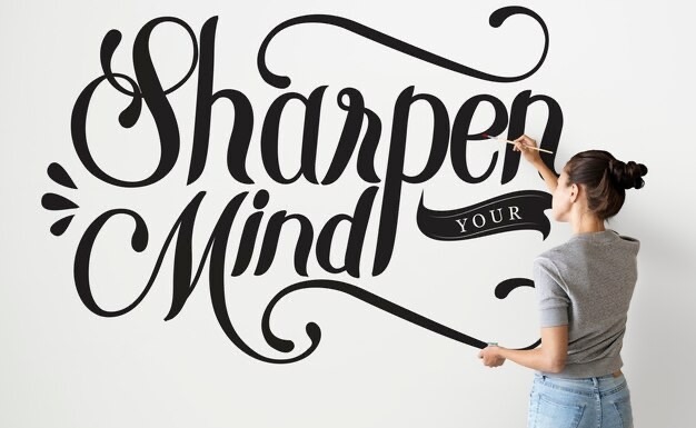 Girl draws an inscription on the wall