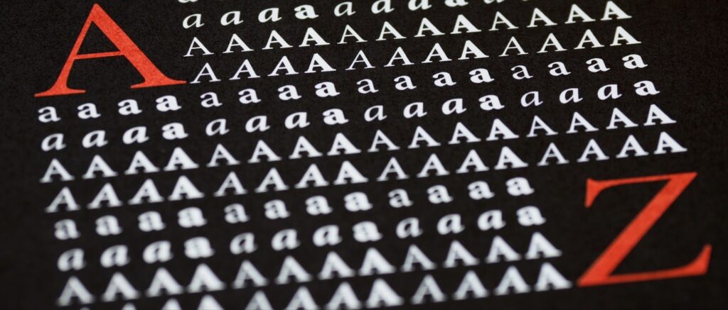 Various letters of different sizes on a black background