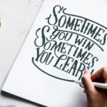 an artist creating hand lettering artwork