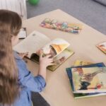 Girl with books on the table