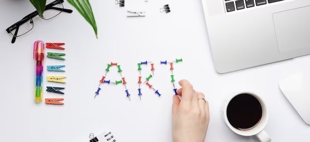 The word Art written with colorful pins on the desktop