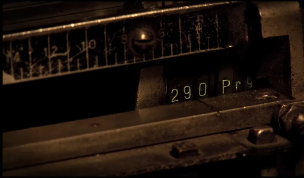 Close-up of a vintage cash register showing the amount 290 and partial text "Prog."