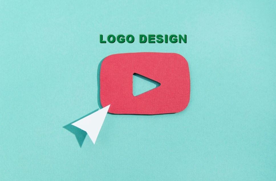 logo design concept: a white arrow and red YouTube logo cut from cardboard